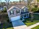 A bird's-eye view of a two-story home highlighting its landscaped yard, driveway, and residential setting at 1309 Belgian Draft Dr, Mount Pleasant, SC 29466
