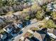 A beautiful aerial view of a neighborhood in a suburban area, with many mature trees at 1309 Belgian Draft Dr, Mount Pleasant, SC 29466