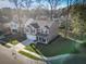 An aerial view of a well-maintained home, featuring a two car garage and landscaped front yard at 1309 Belgian Draft Dr, Mount Pleasant, SC 29466