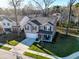 An aerial view of a well-maintained home, featuring a two car garage and landscaped front yard at 1309 Belgian Draft Dr, Mount Pleasant, SC 29466
