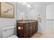 Bathroom features a double sink vanity with granite countertop and dark wood cabinets at 1309 Belgian Draft Dr, Mount Pleasant, SC 29466