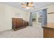 Bedroom featuring a wooden crib, carpeted floor, two windows, and blue curtains at 1309 Belgian Draft Dr, Mount Pleasant, SC 29466