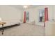 Bedroom with carpet, two windows with curtains, and furniture, illuminated by a ceiling fan at 1309 Belgian Draft Dr, Mount Pleasant, SC 29466