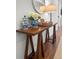 Inviting entryway featuring stylish decor, a wooden console table, and a round mirror at 1309 Belgian Draft Dr, Mount Pleasant, SC 29466