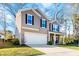 Beautiful two-story home with a two-car garage and an inviting covered front porch at 1309 Belgian Draft Dr, Mount Pleasant, SC 29466