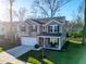 Charming two-story home with a white garage door, dark shutters, and a well-maintained lawn at 1309 Belgian Draft Dr, Mount Pleasant, SC 29466