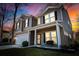 Charming two-story home with a covered porch, landscaped front yard, and a two car garage at 1309 Belgian Draft Dr, Mount Pleasant, SC 29466