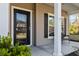 View of a front porch, house number, columns, security camera, exterior window with shutter, and small bench at 1309 Belgian Draft Dr, Mount Pleasant, SC 29466