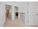 Hallway with carpeted floor and decorative black metal and wood railings leading to bedrooms at 1309 Belgian Draft Dr, Mount Pleasant, SC 29466