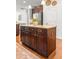 Kitchen island with dark wood cabinets, granite countertops, and ample storage space at 1309 Belgian Draft Dr, Mount Pleasant, SC 29466