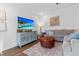 Cozy living room featuring stylish decor, a flat screen TV, hardwood floors, and a comfortable seating area at 1309 Belgian Draft Dr, Mount Pleasant, SC 29466