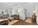 Comfortable living room with neutral tones, large windows, and plush furniture, creating an inviting atmosphere at 1309 Belgian Draft Dr, Mount Pleasant, SC 29466