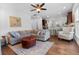 Open-concept living room flows to a modern kitchen perfect for entertaining, with plush seating and a ceiling fan at 1309 Belgian Draft Dr, Mount Pleasant, SC 29466