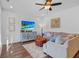 Cozy living room featuring stylish decor, a flat screen TV, hardwood floors, and a comfortable seating area at 1309 Belgian Draft Dr, Mount Pleasant, SC 29466