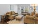 Comfortable living room with neutral tones, large windows, and plush furniture, creating an inviting atmosphere at 1309 Belgian Draft Dr, Mount Pleasant, SC 29466