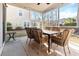This well-lit screened porch is perfect for outdoor dining and entertaining, with a dining set at 1309 Belgian Draft Dr, Mount Pleasant, SC 29466