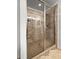 Modern glass-enclosed shower with tiled walls and built-in bench seating at 1309 Belgian Draft Dr, Mount Pleasant, SC 29466