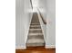 Carpeted staircase with wooden handrail, leading to the upper level of the home at 1309 Belgian Draft Dr, Mount Pleasant, SC 29466