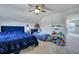 A bright bedroom with plush carpet, a ceiling fan, and large comfortable beds at 131 Swaying Palm Dr, Summerville, SC 29485