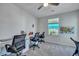 Office with built-in desks, rolling chairs, carpeted floor, and natural light at 131 Swaying Palm Dr, Summerville, SC 29485