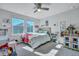 Bedroom showcasing a bed, a dollhouse, and a window at 131 Swaying Palm Dr, Summerville, SC 29485