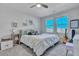 Bright bedroom featuring a ceiling fan, comfortable bed, and natural light from double windows at 131 Swaying Palm Dr, Summerville, SC 29485