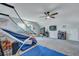 Spacious bonus room featuring plush carpet, ceiling fan, and ample space for games and entertainment at 131 Swaying Palm Dr, Summerville, SC 29485