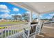 Charming front porch with rocking chairs overlooking the neighborhood at 131 Swaying Palm Dr, Summerville, SC 29485