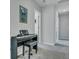 Bright hallway featuring a piano, neutral paint, plush carpet, and doorways leading to other rooms at 131 Swaying Palm Dr, Summerville, SC 29485