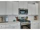 Kitchen with stainless steel appliances, quartz counters and white subway tile at 131 Swaying Palm Dr, Summerville, SC 29485