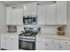 Kitchen with stainless steel appliances, quartz counters and white subway tile at 131 Swaying Palm Dr, Summerville, SC 29485