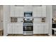 Kitchen with stainless steel appliances, quartz counters and white subway tile at 131 Swaying Palm Dr, Summerville, SC 29485