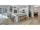 Kitchen island with seating, quartz counters, and stainless appliances at 131 Swaying Palm Dr, Summerville, SC 29485