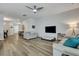 Spacious open-concept living area, featuring hardwood floors, and comfortable seating at 131 Swaying Palm Dr, Summerville, SC 29485