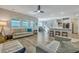 Bright, open living space featuring hardwood floors and a modern ceiling fan at 131 Swaying Palm Dr, Summerville, SC 29485