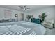 Bright main bedroom with plush carpet, natural light, ceiling fan, and space for decor at 131 Swaying Palm Dr, Summerville, SC 29485