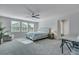 Spacious main bedroom with natural light, plush carpet, and a ceiling fan at 131 Swaying Palm Dr, Summerville, SC 29485