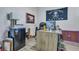 Functional office space with modern desk, storage, and casual decor, ideal for remote work at 131 Swaying Palm Dr, Summerville, SC 29485