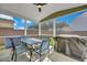 Covered patio featuring a ceiling fan and dining table perfect for outdoor entertaining at 131 Swaying Palm Dr, Summerville, SC 29485