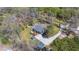 An aerial view showcasing the home's backyard deck, lush lawn, and extended driveway at 146 Picard Dr, Ladson, SC 29456