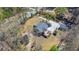 Aerial view of backyard with deck featuring a hot tub, and additional sheds on property at 146 Picard Dr, Ladson, SC 29456