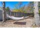 Inviting backyard featuring a hammock strung between trees on a bed of white gravel at 146 Picard Dr, Ladson, SC 29456