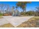 Expansive backyard showcasing a well-maintained lawn and a detached garage at 146 Picard Dr, Ladson, SC 29456