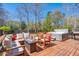 Outdoor deck featuring a hot tub, fire pit, and comfortable seating, ideal for relaxation at 146 Picard Dr, Ladson, SC 29456