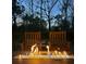 Cozy outdoor fire pit with chairs, ideal for gatherings on the wooden deck at 146 Picard Dr, Ladson, SC 29456