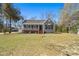 Inviting one-story home with a covered front porch, set on a well-manicured lawn at 146 Picard Dr, Ladson, SC 29456