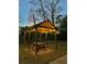 Outdoor gazebo with picnic table and string lights, perfect for evening relaxation at 146 Picard Dr, Ladson, SC 29456