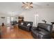 Open living area featuring wood floors, a cozy leather sofa and vaulted ceiling with a ceiling fan at 146 Picard Dr, Ladson, SC 29456