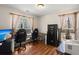 Well-lit home office featuring wood floors, a large safe, and windows with outdoor views at 146 Picard Dr, Ladson, SC 29456