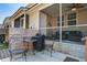 Exterior shot including a patio, screened porch, table set, and grill in the backyard at 156 Woodward Rd, Goose Creek, SC 29445